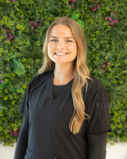 Mikayla, dental team member at Gregory Building practice in Pompano Beach, smiling.